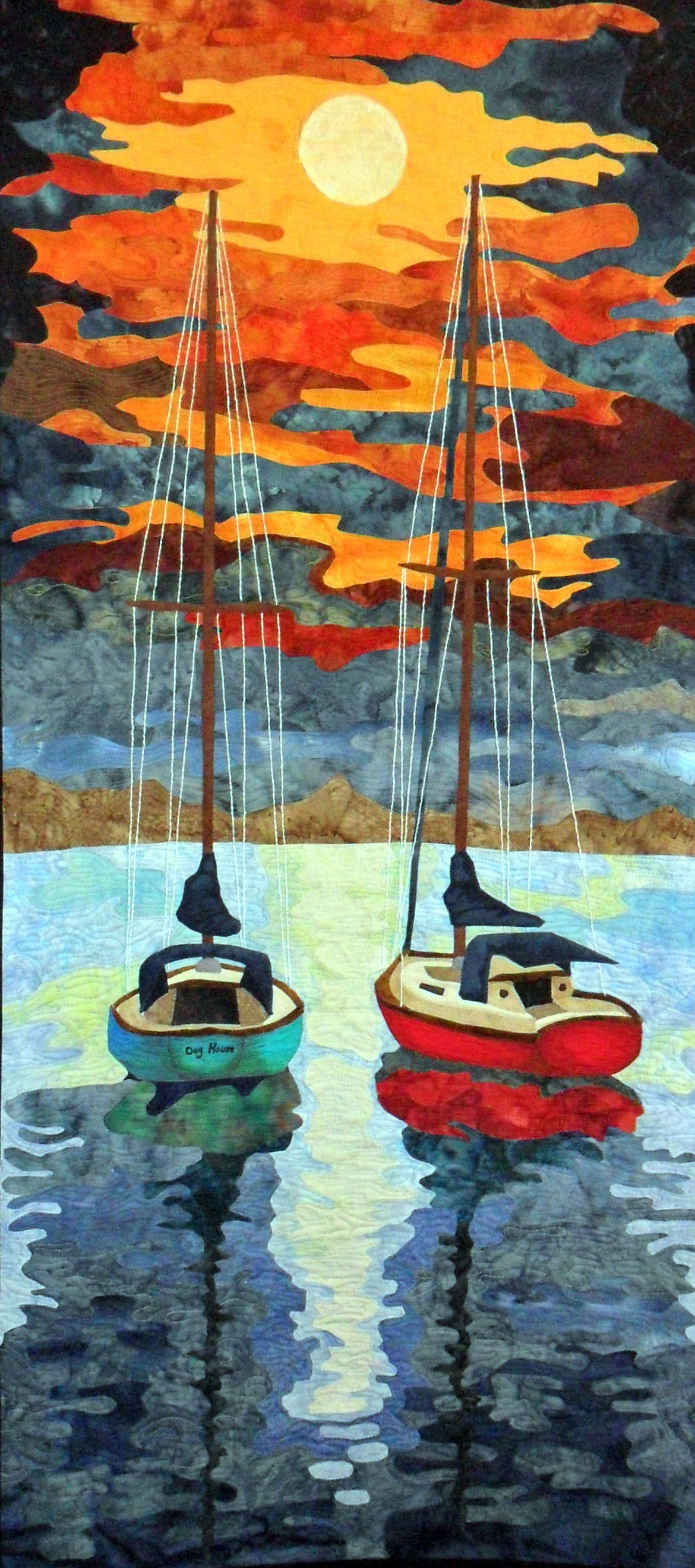 Kemah After Hours is a Fiber Art work representing two boats floatin
side by side at night in Kemah,Texas with the moon reflecting on the water and the breeze gently rockin the boats and singing in the rigging