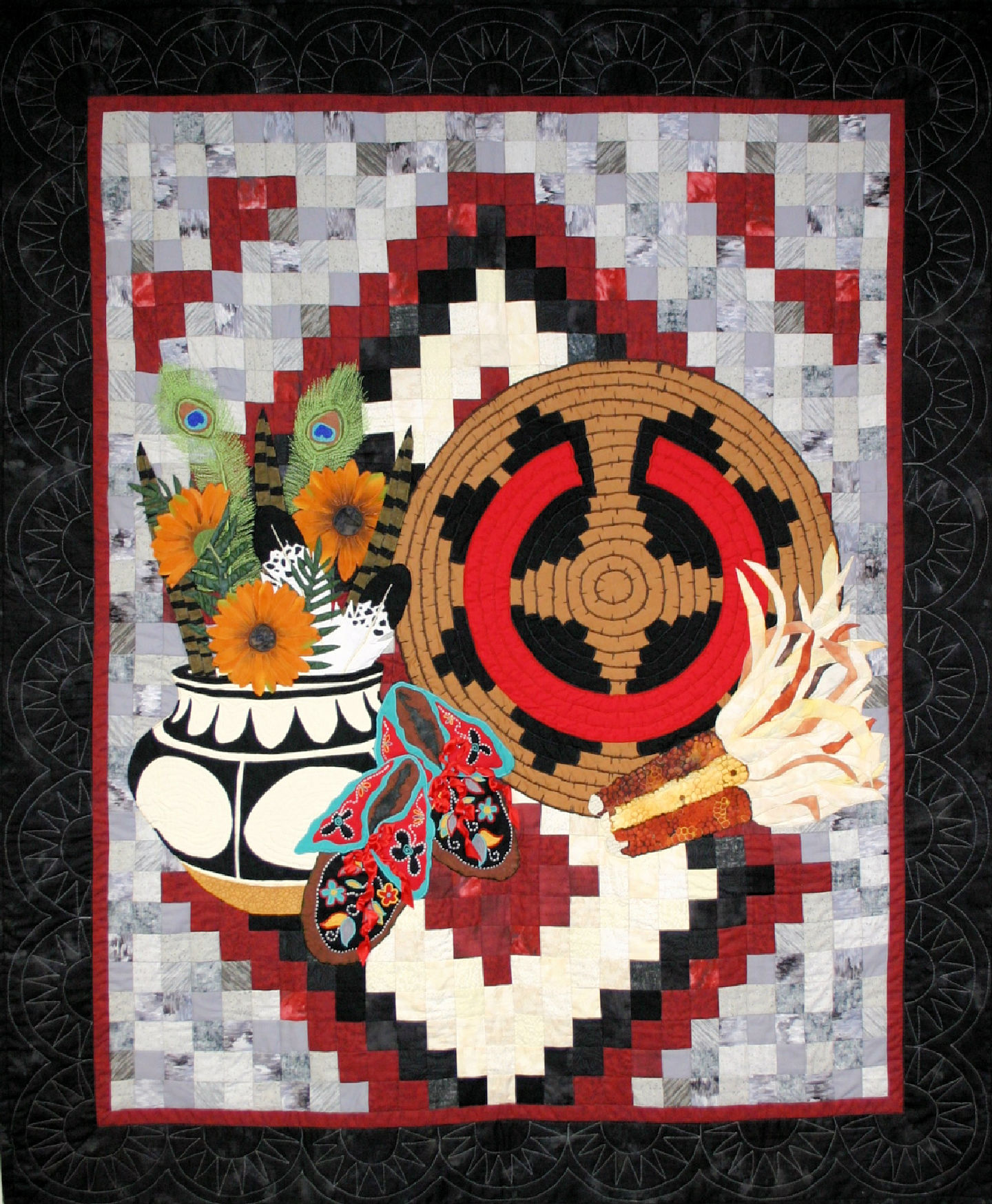 Navajo Still Life is a fiber art work with an Indian Basket, a black and white 
navajo style bowl and some colorful dried indian corn and moccasins with detailed ribbon work backed by a navajo style rug. This work was a juried finalist
 at the Houston International Quilt Festival in 2007